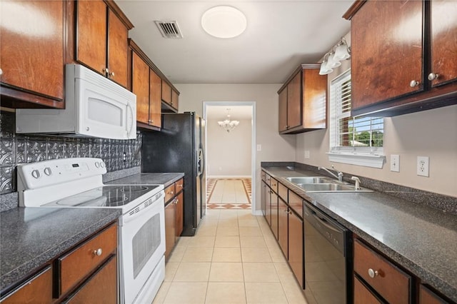10966 Brighton Dr W, Chunchula, AL 36521 - kitchen featuring black appliances, a sink, light tile patterned floors, and dark countertops