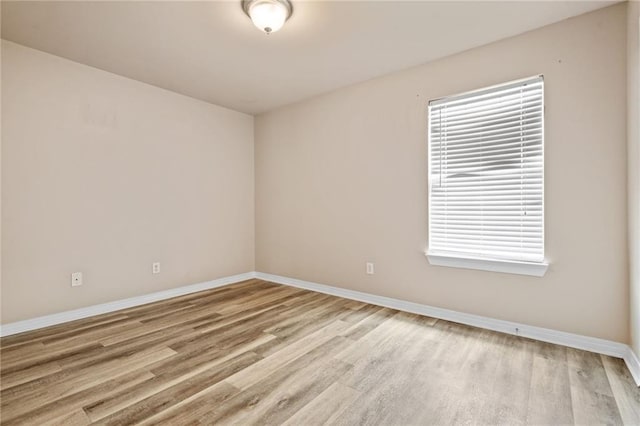 10966 Brighton Dr W, Chunchula, AL 36521 - empty room featuring baseboards and light wood-type flooring