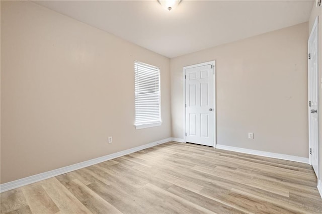 10966 Brighton Dr W, Chunchula, AL 36521 - unfurnished bedroom with baseboards and light wood finished floors