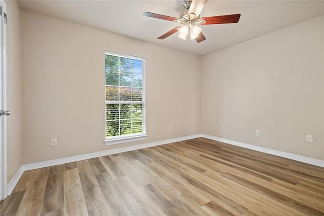 10966 Brighton Dr W, Chunchula, AL 36521 - empty room with ceiling fan, wood finished floors, and baseboards