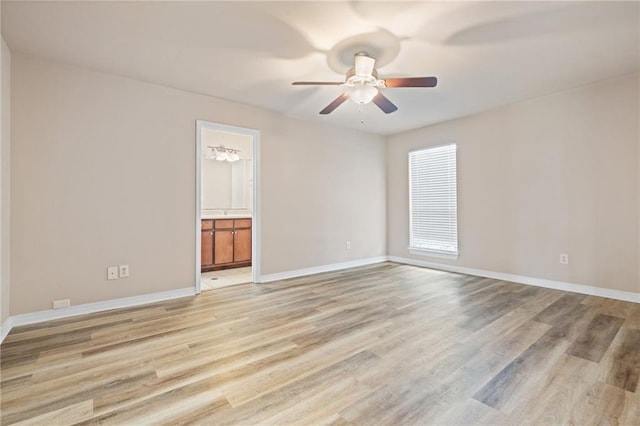 10966 Brighton Dr W, Chunchula, AL 36521 - unfurnished room featuring ceiling fan, light wood-style floors, and baseboards