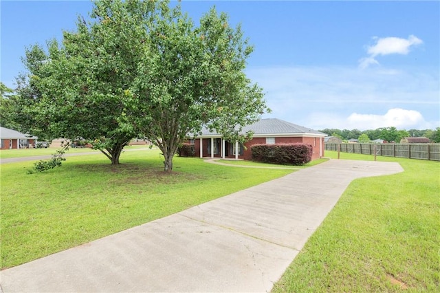 10966 Brighton Dr W, Chunchula, AL 36521 - view of yard featuring concrete driveway