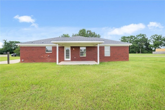10966 Brighton Dr W, Chunchula, AL 36521 - back of house featuring a patio area, a yard, and brick siding