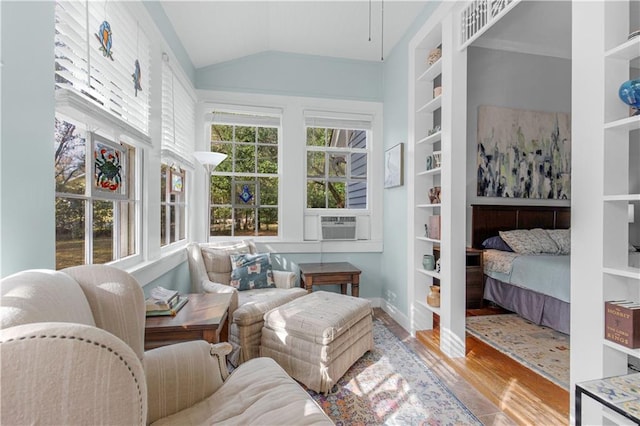 sunroom / solarium with lofted ceiling