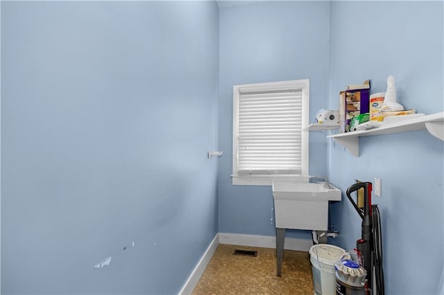 office space with visible vents and baseboards