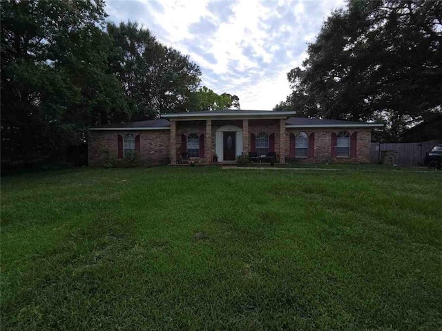 2460 Maple Dr, Mobile, AL 36695 - ranch-style house featuring a front yard and brick siding