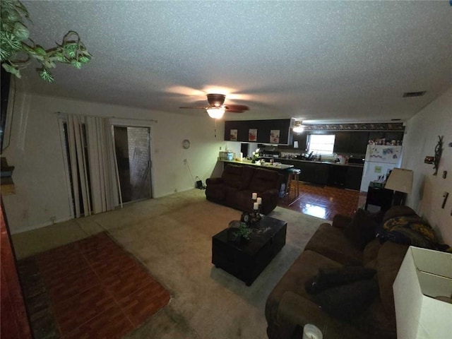 2460 Maple Dr, Mobile, AL 36695 - living room with a textured ceiling and a ceiling fan