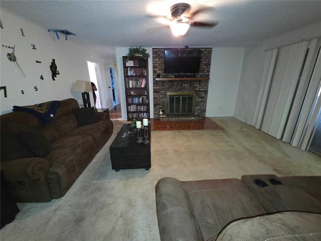 2460 Maple Dr, Mobile, AL 36695 - carpeted living room with a ceiling fan, a textured ceiling, and a brick fireplace