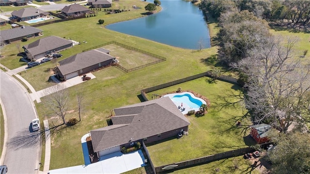 birds eye view of property with a water view