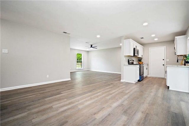 1513 Carlisle Dr W, Mobile, AL 36618 - unfurnished living room with wood finished floors, recessed lighting, baseboards, and a ceiling fan