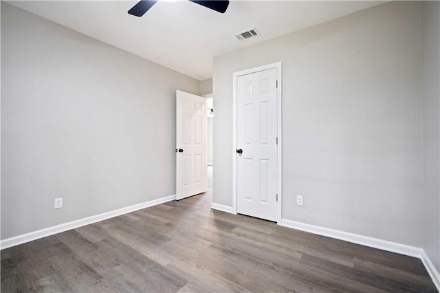 1513 Carlisle Dr W, Mobile, AL 36618 - unfurnished bedroom with wood finished floors, baseboards, and ceiling fan