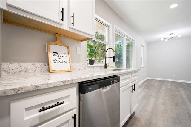 1513 Carlisle Dr W, Mobile, AL 36618 - kitchen featuring dishwasher, a sink, white cabinetry, wood finished floors, and light stone counters