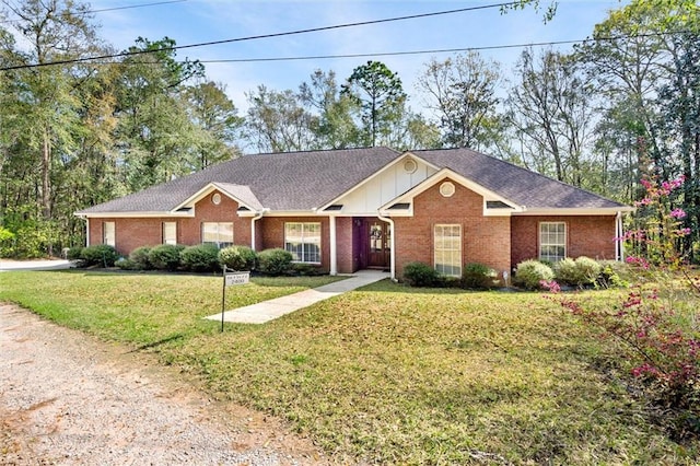 single story home featuring a front yard