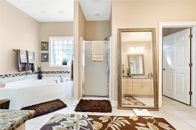 bathroom featuring tile patterned floors, vanity, and independent shower and bath