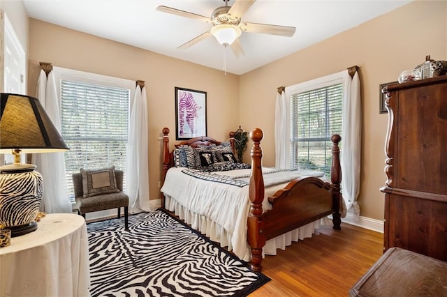 bedroom featuring ceiling fan and light hardwood / wood-style flooring