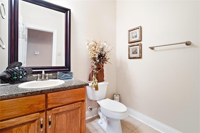 bathroom featuring tile patterned flooring, vanity, and toilet