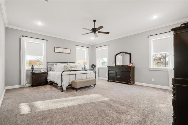 bedroom featuring light carpet, crown molding, and ceiling fan