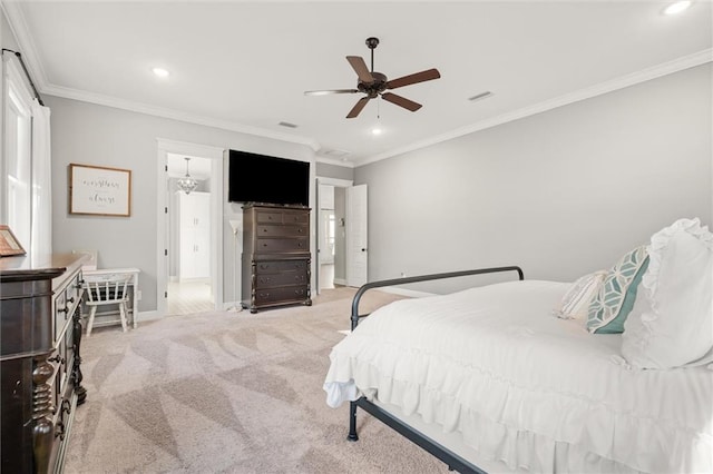 carpeted bedroom featuring ornamental molding and ceiling fan