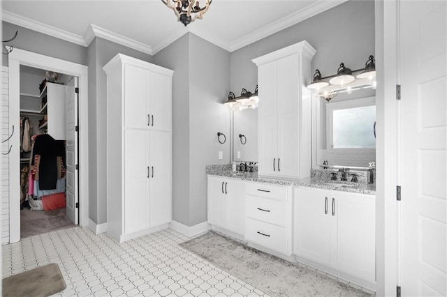 bathroom with vanity and ornamental molding