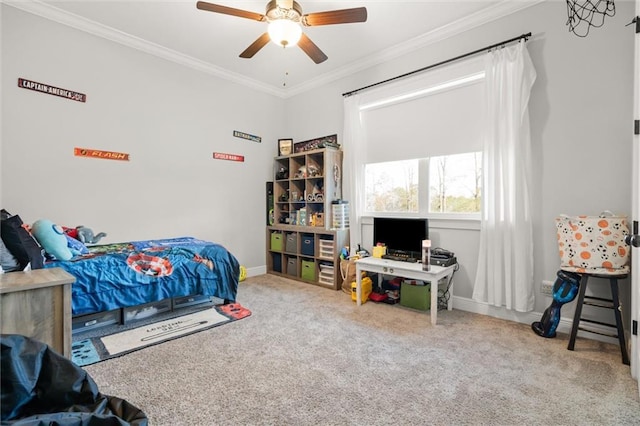 bedroom with crown molding, ceiling fan, and carpet floors