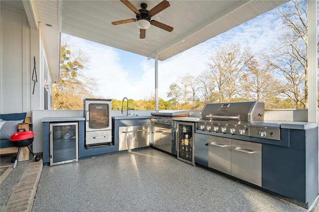 view of patio / terrace featuring a grill, sink, ceiling fan, and exterior kitchen