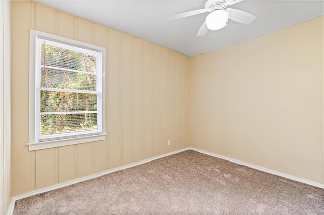 carpeted empty room with ceiling fan