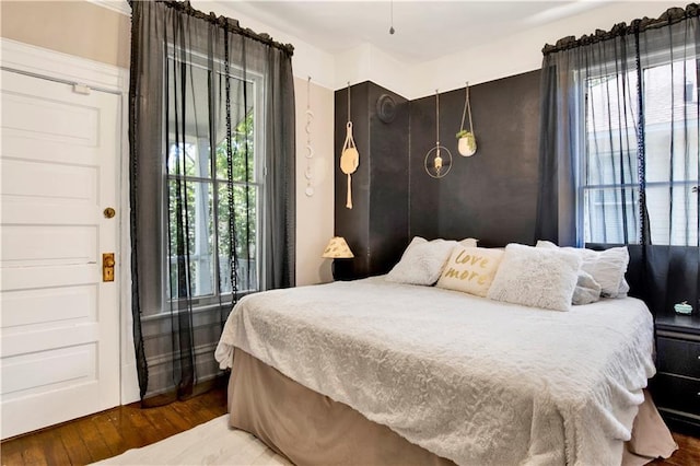 bedroom with wood finished floors