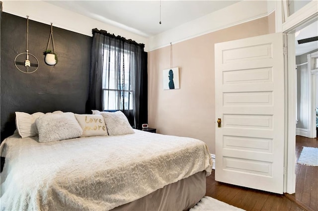 bedroom featuring dark wood-type flooring