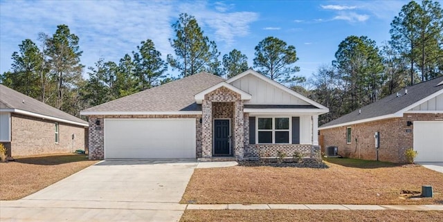 craftsman-style house with a garage and central AC