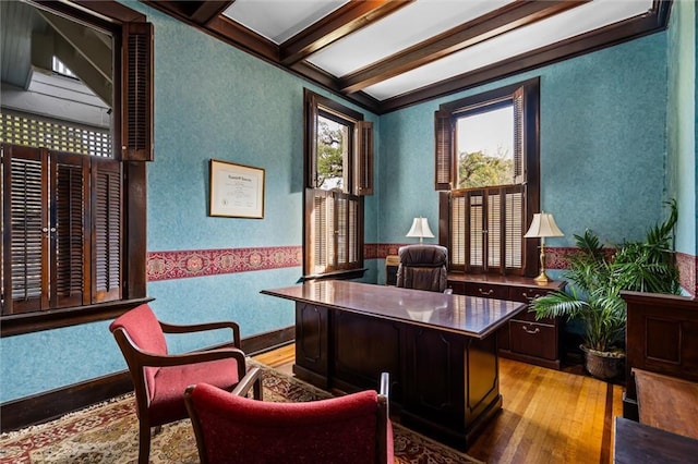 home office featuring beam ceiling, light wood-type flooring, and coffered ceiling