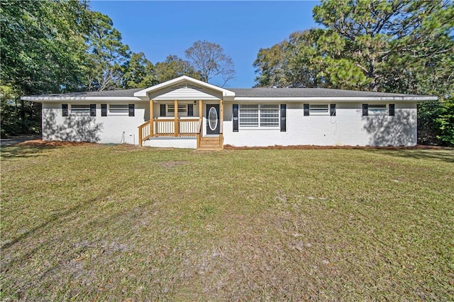 ranch-style home with a front lawn and covered porch