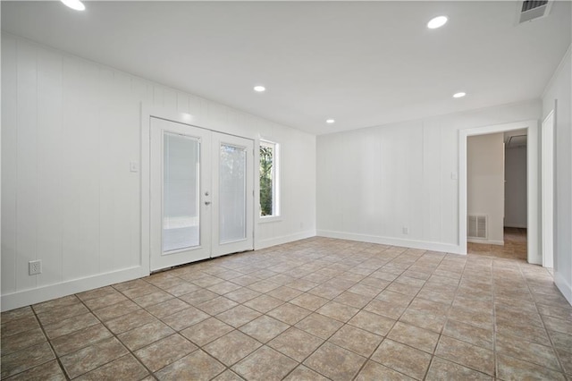 spare room featuring french doors