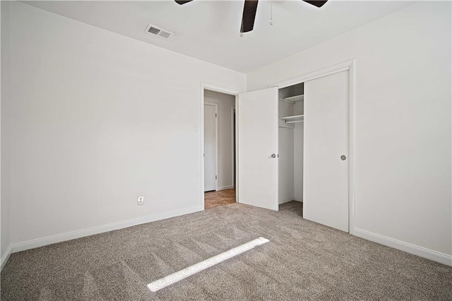 unfurnished bedroom with ceiling fan, a closet, and carpet floors