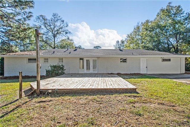 back of house with a yard and french doors