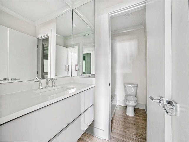 full bathroom with toilet, vanity, shower / bath combination, and hardwood / wood-style flooring