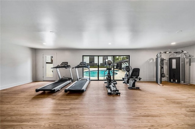 workout room featuring light hardwood / wood-style floors