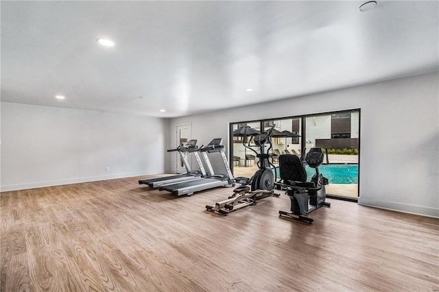 exercise area with light hardwood / wood-style floors