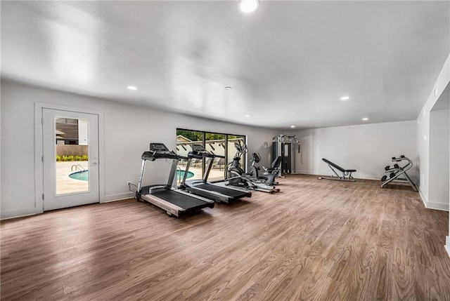 exercise room featuring wood-type flooring and a wealth of natural light