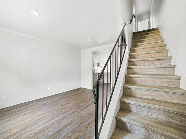 staircase featuring light hardwood / wood-style flooring