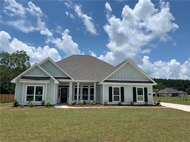 craftsman-style home with a front yard