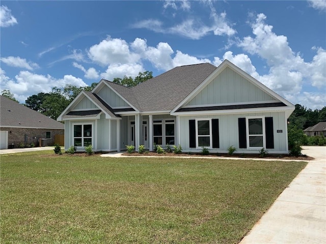 craftsman inspired home with a front lawn