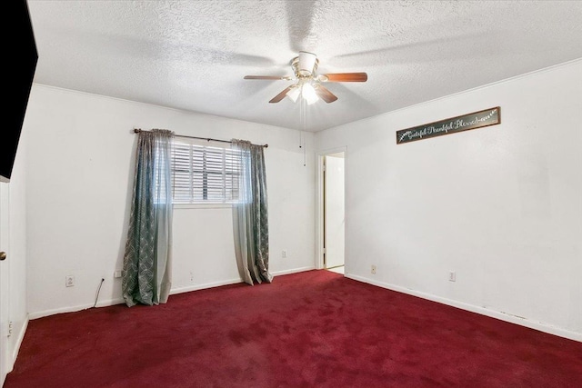 spare room with carpet flooring, a textured ceiling, and ceiling fan