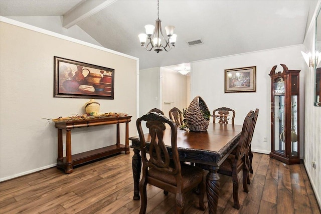 dining area featuring lofted ceiling with beams, crown molding, dark wood-type flooring, and an inviting chandelier