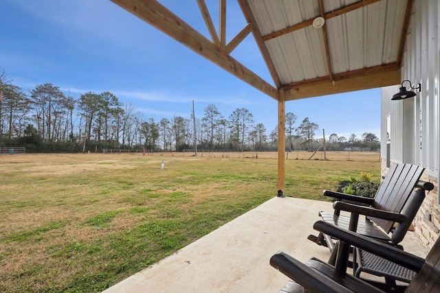 view of yard featuring a patio and a rural view