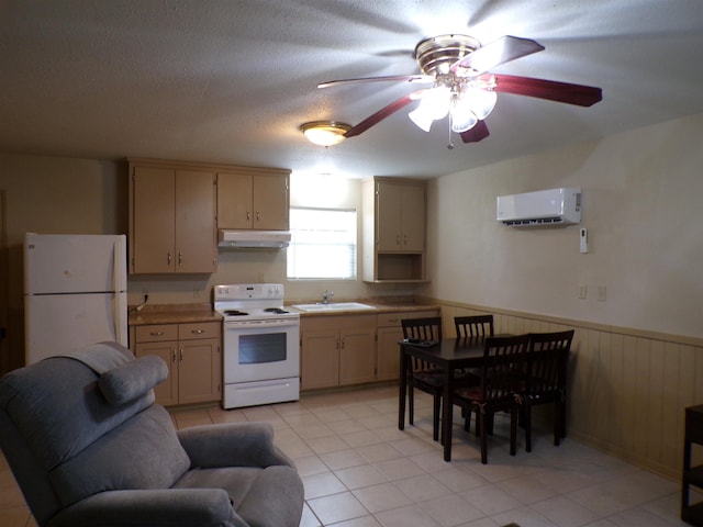 kitchen with white appliances, wainscoting, a wall unit AC, light countertops, and under cabinet range hood