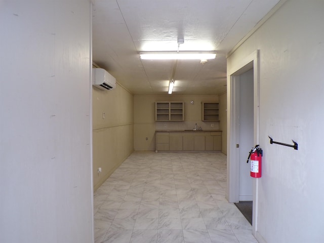 interior space with an AC wall unit and a sink