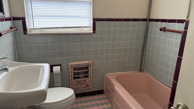 4011 Everglades Ave, Port Arthur, TX 77642 - full bathroom with tile walls, a bathtub, and heating unit