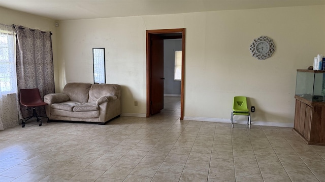 4011 Everglades Ave, Port Arthur, TX 77642 - living area featuring plenty of natural light and light tile patterned floors