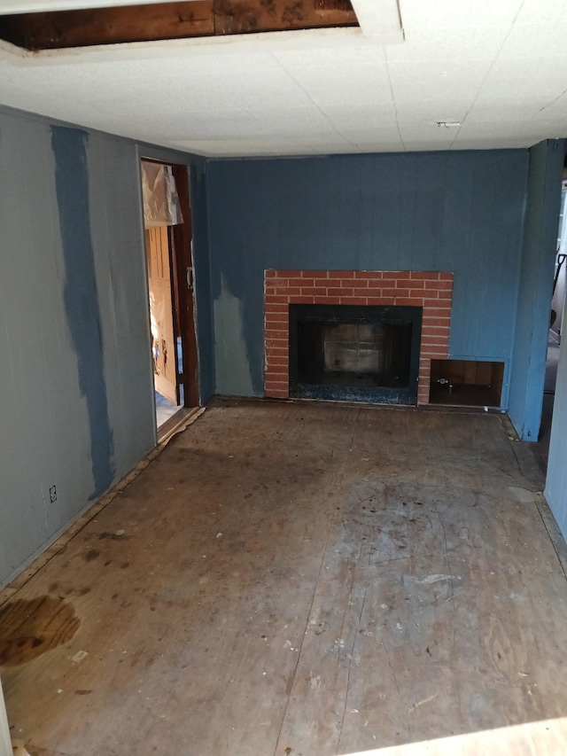 unfurnished living room featuring a fireplace