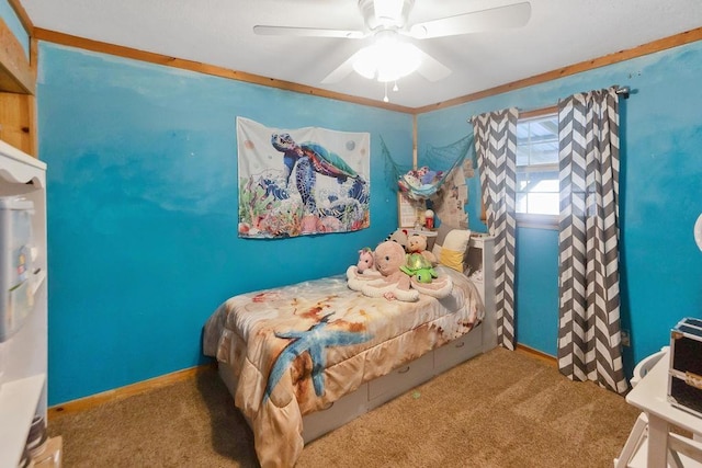 carpeted bedroom featuring ceiling fan and crown molding